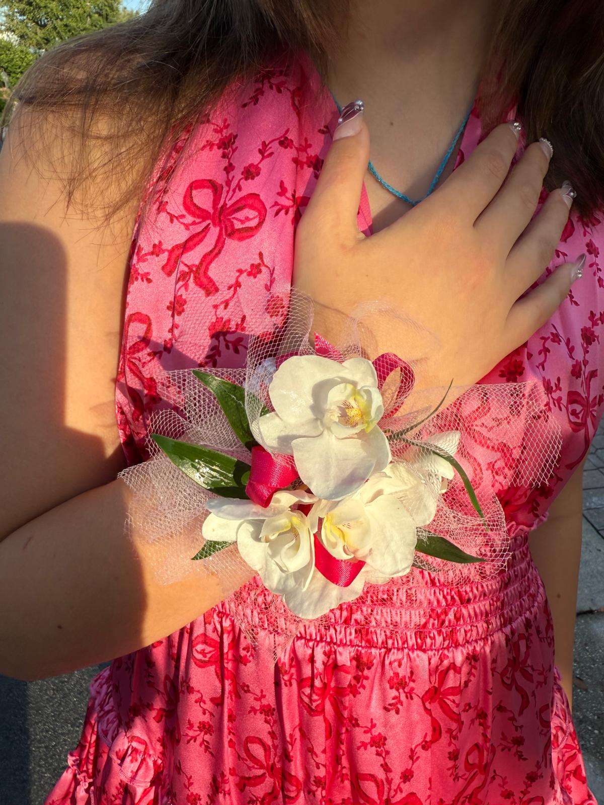 corsage with white orchids